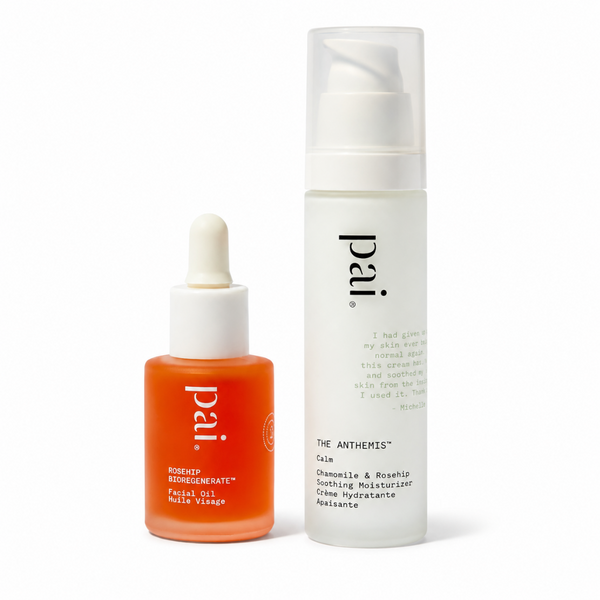 Two skincare products from the brand pai on a clean white background: a white pump bottle of The Anthems Calm soothing moisturizer and an orange dropper bottle of Rosehip Restorative facial oil.