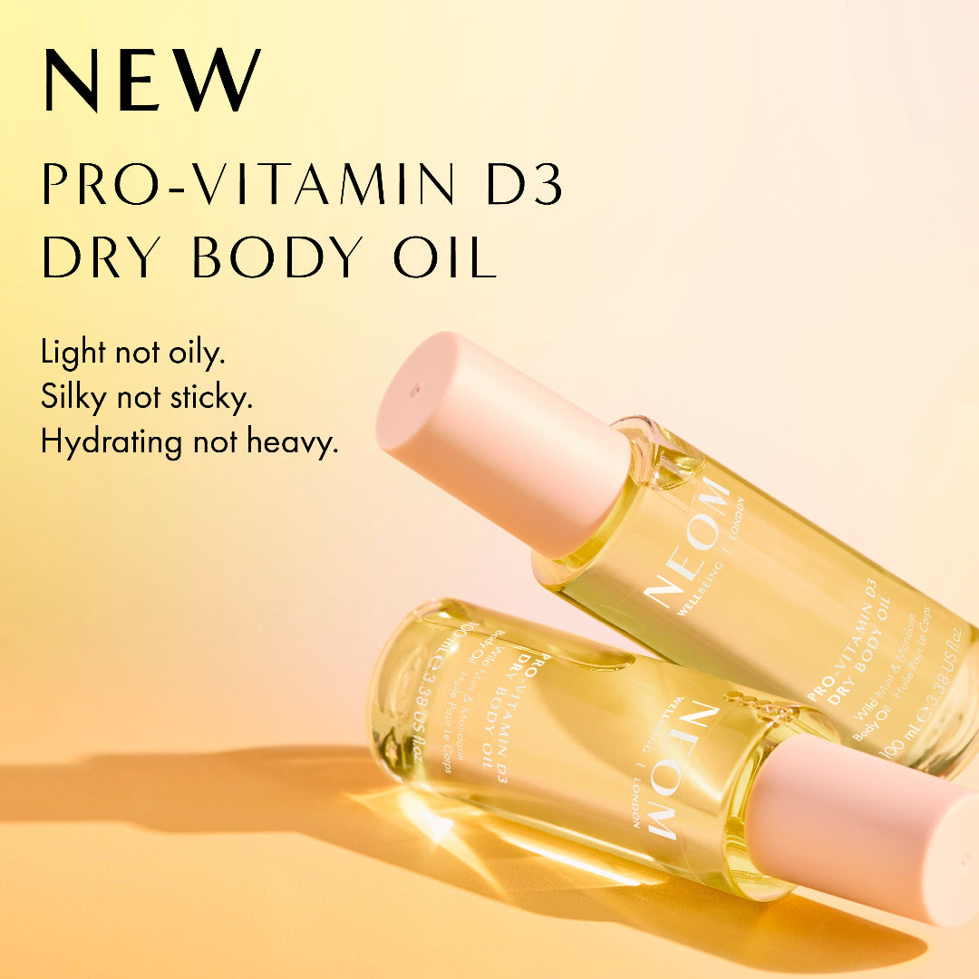 Pro-Vitamin D3 dry body oil with a pump on a beige background
