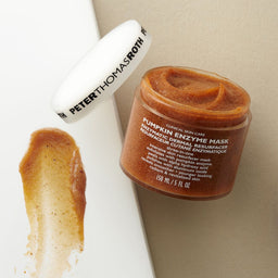 Peter Thomas Roth Pumpkin Enzyme Mask Enzymatic Dermal Resurfacer 5.1tub with a smudge  of texture next to it