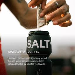 Person adding a Puresport supplements to a Puresport bottle with text about Informed Sport Certification.