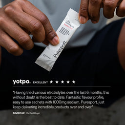 Puresport electrolyte sachet held by a track runner with a yotpo review displayed below.