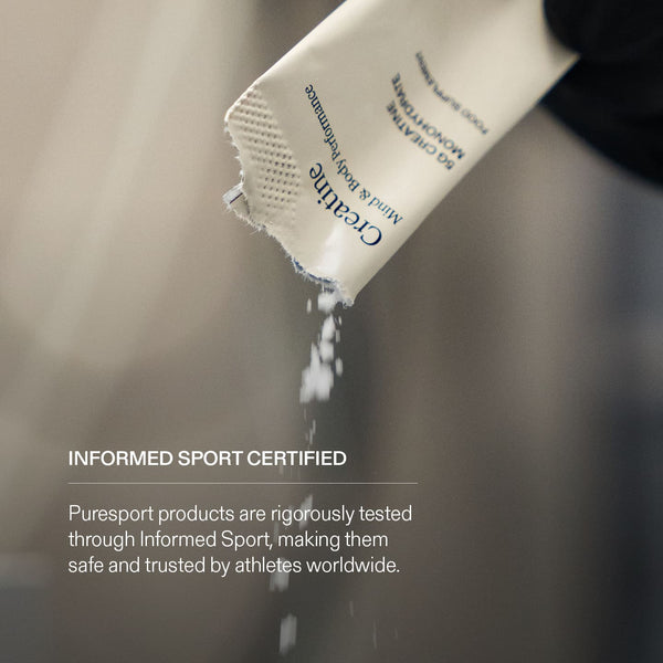Creatine being poured from a Puresport Sachet with Informed Sports Certified text on it. 