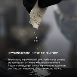 Hand holding a white sachet of Creatine with text, blurred background