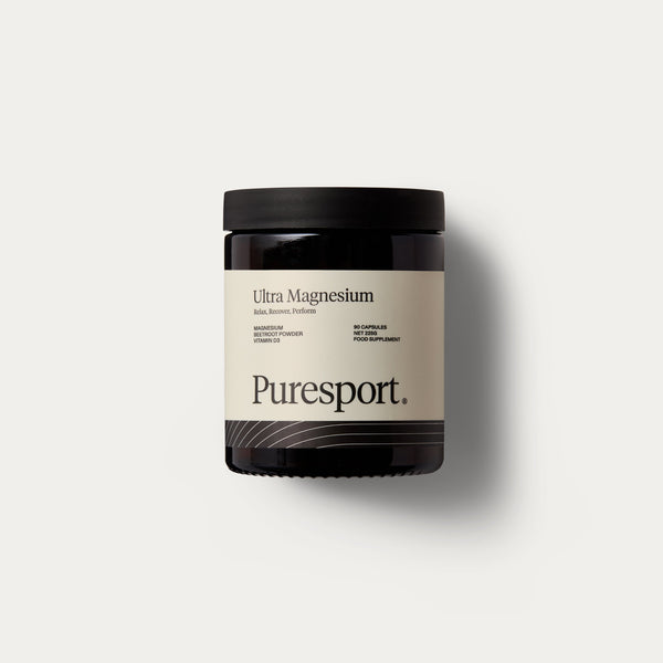 A jar of magnesium supplements by Puresport with a label that includes the Puresport logo and ingredients such as beetroot powder and vitamin d3. 