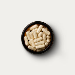 Vitamin D3 jar by Puresport open with 60 capsules inside. 