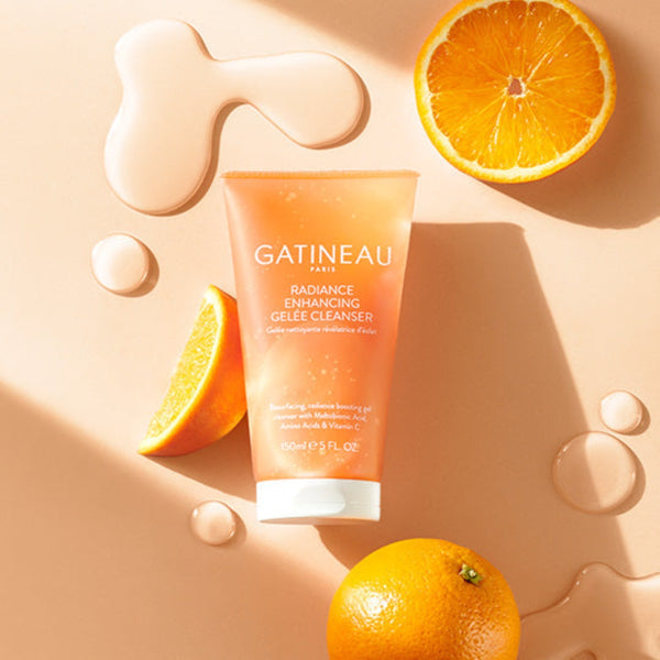 Gatineau Radiance Enhancing Gelee Cleanser with slices of orange placed next to it
