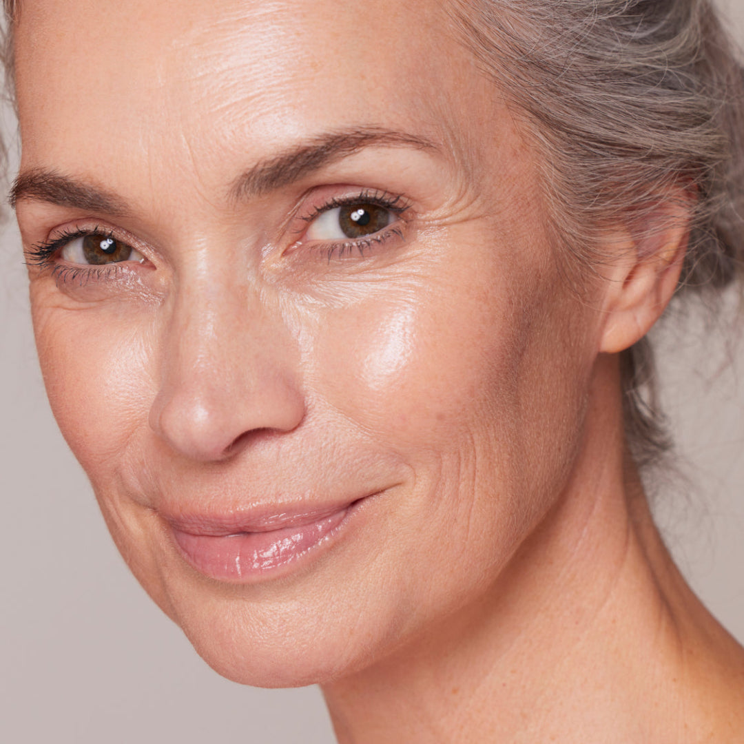 Close-up of a woman's face with a neutral background