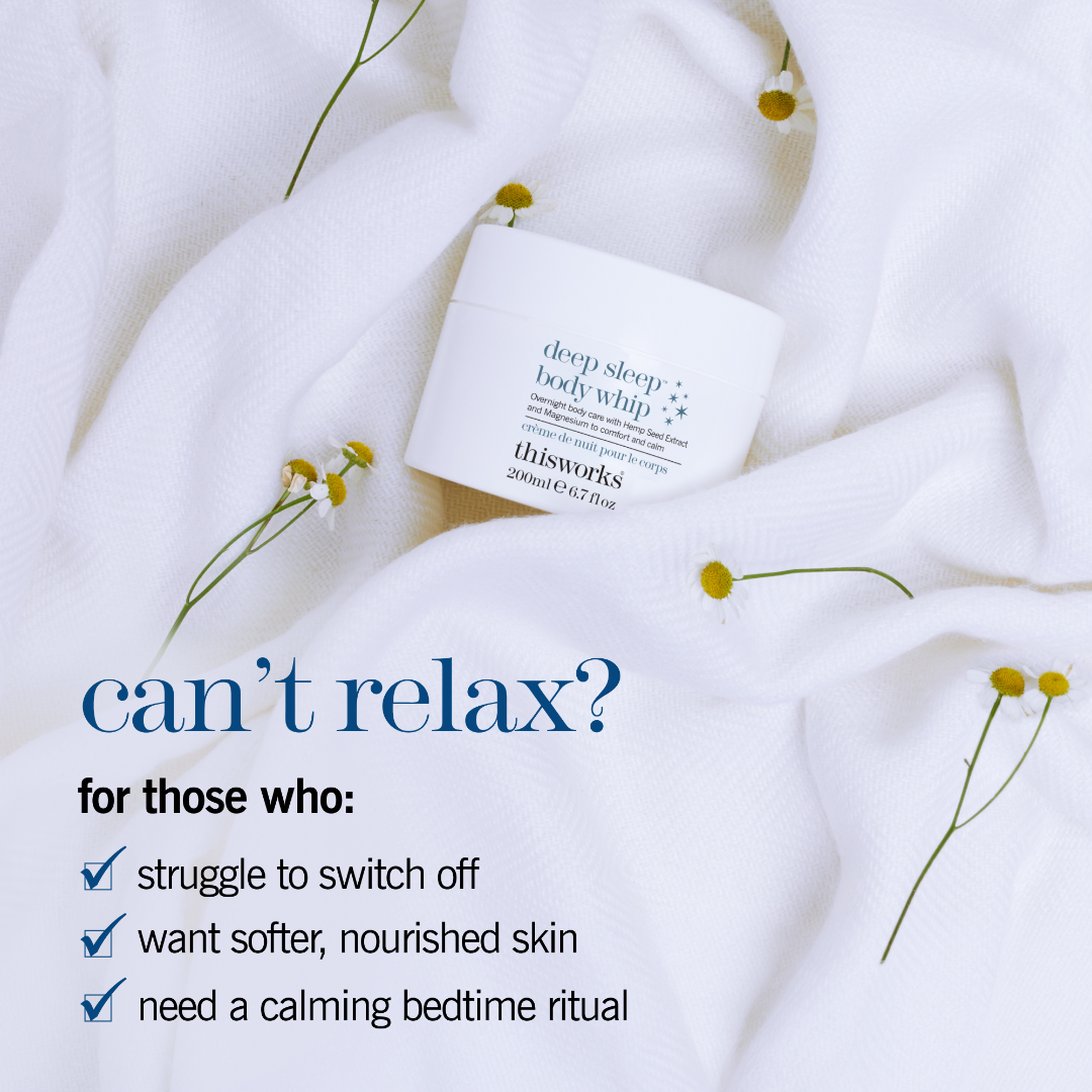 A white jar of thisworks Deep Sleep Body Whip body butter rests on soft white textured fabric with small yellow flowers scattered around it. Blue promotional text on the left reads, 'can’t relax? for those who: struggle to switch off, want softer, nourished skin, need a calming bedtime ritual.