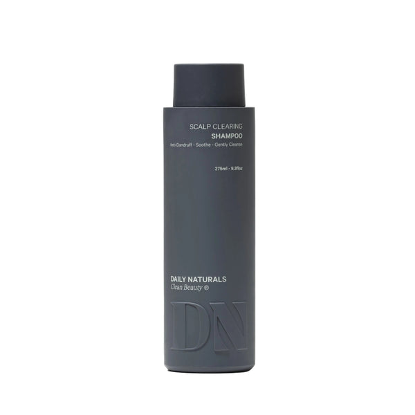 Dark gray shampoo bottle with 'Daily Naturals' branding on a light gray background