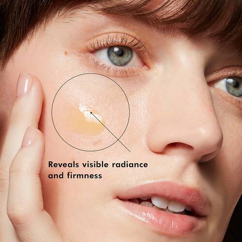 a woman applying SkinCeuticals Resveratrol B E to her face