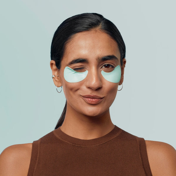 model with eye patches applied to her face