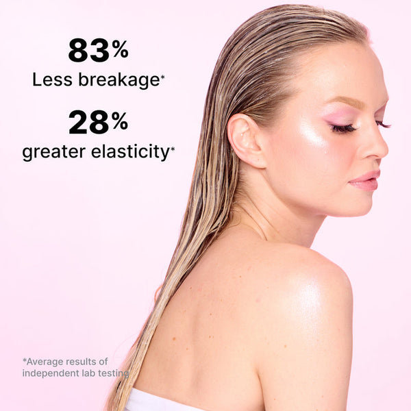 Woman with wet hair against a pink background with text about hair health benefits.