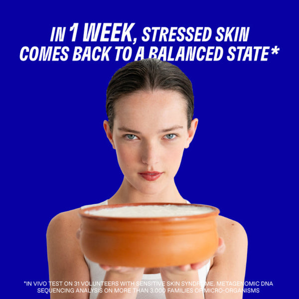 Woman holding a bowl with text about skin health on a blue background