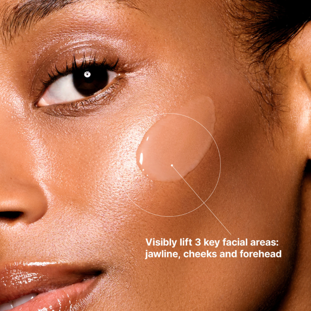 Close-up of a woman's face with makeup application instructions on her cheek.