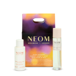 NEOM skincare products including bath foam, mist, and packaging on a white background