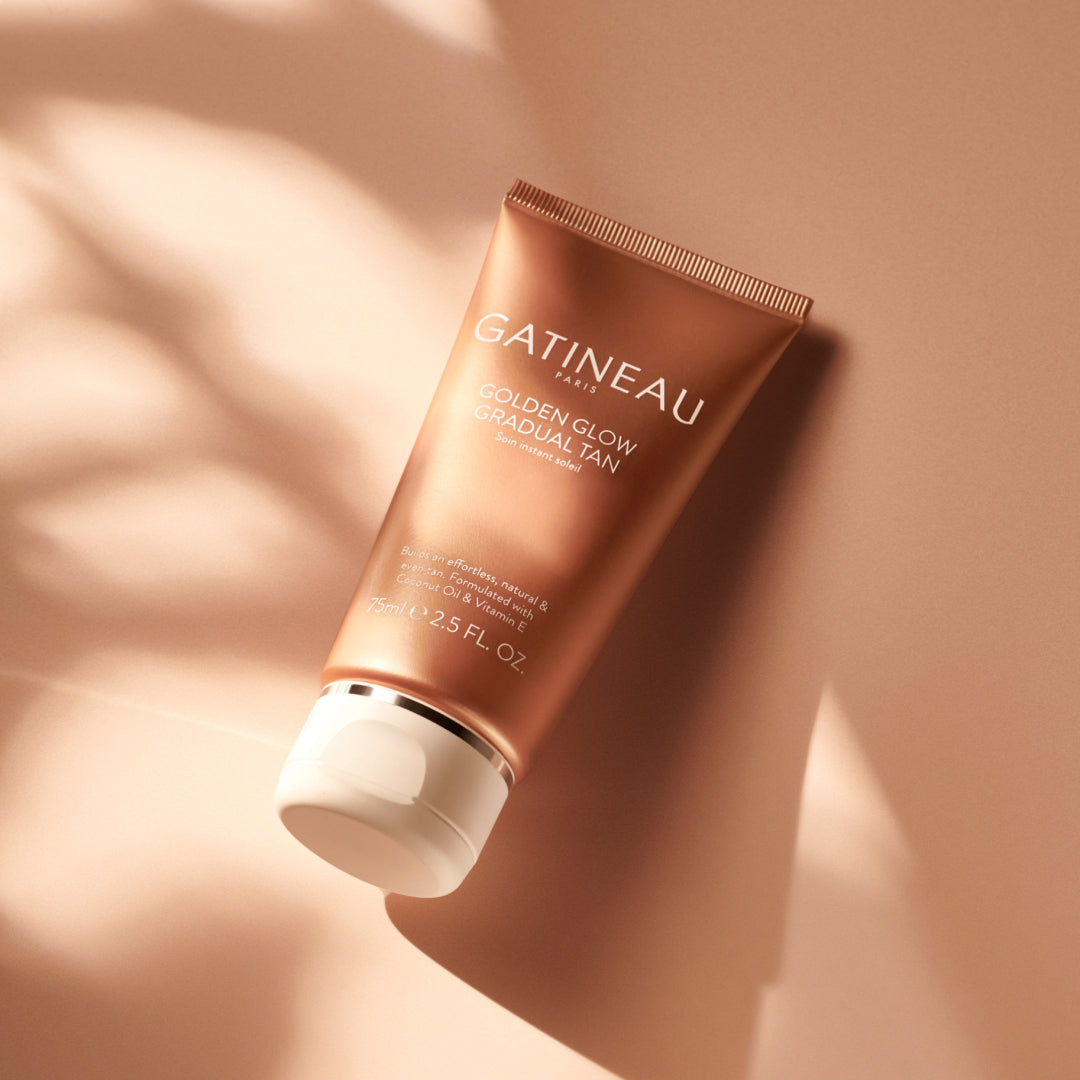 Gatineau Golden Glow Gradual Tan tube on a beige background