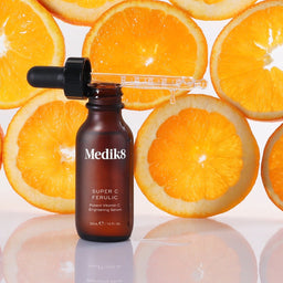 Medik8 Super C Ferulic with slices of oranges being the bottle