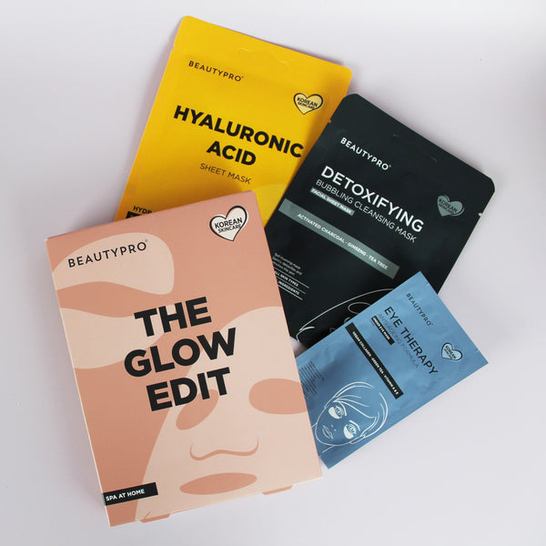 Four BeautyPro skincare mask packets arranged on a white background: a yellow Hyaluronic Acid sheet mask, a black Detoxifying Cleansing mask, a peach-toned The Glow Edit spa at home mask, and a blue Eye Therapy mask.