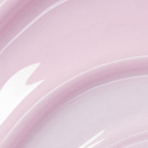 Close-up of a pink and white ceramic plate with a subtle pattern.