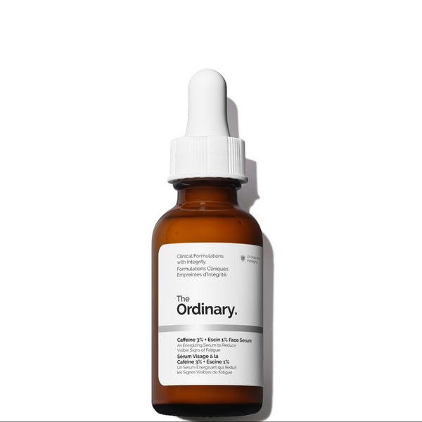 Amber glass dropper bottle with white label on a white background