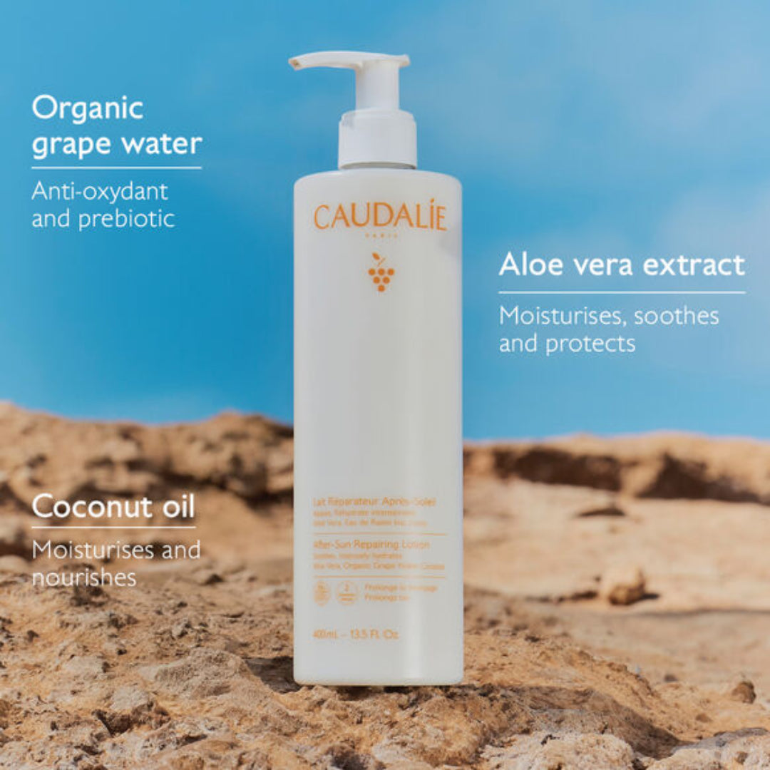 Caudalie skincare product on a rocky surface with a blue sky background