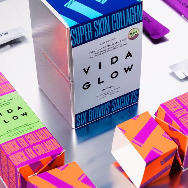 Vida Glow collagen packaging on a reflective surface