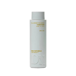 White bottle of Daily Naturals conditioner on a light gray background