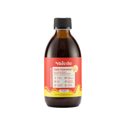 Bottle of Valerie Daily Essential on a light beige background