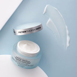 Peter Thomas Roth Water Drench Hyaluronic Cloud Cream Hydrating Moisturizer tub with a smear of texture next to the tub