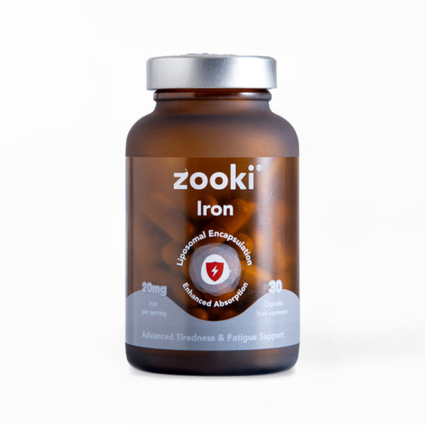 A brown amber bottle of zooki Iron dietary supplement with a silver cap, shown on a clean white background.