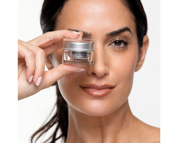 model holding the jar close to her eye