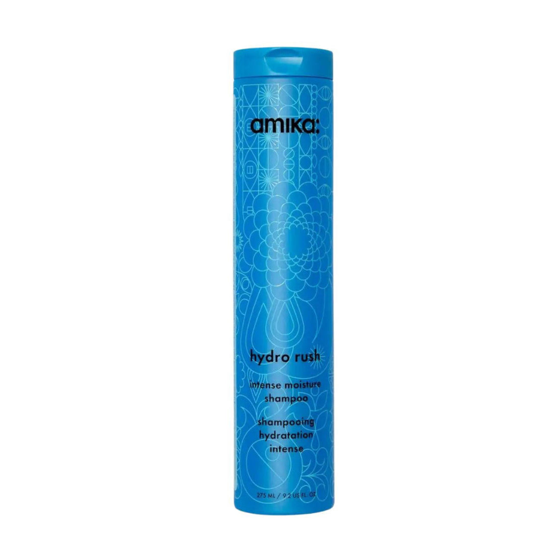 Blue shampoo bottle with 'amika' branding on a white background