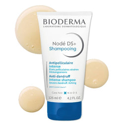 BIODERMA Nodé Anti-Dandruff Shampoo with contents dotted behind it
