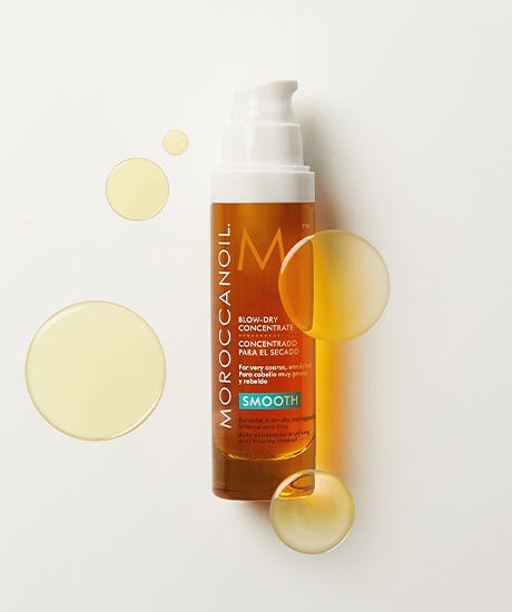 Moroccanoil Blow Dry Concentrate bottle with textured spots around