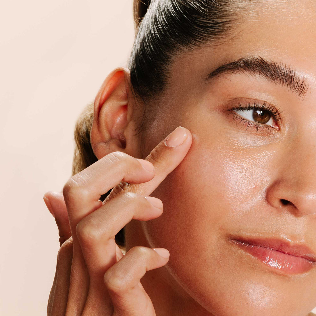 Model applying Dermalogica Breakout Clearing Booster
