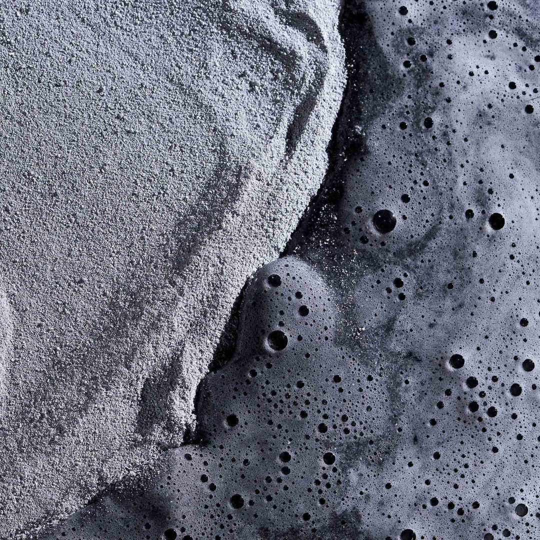 Close-up of textured gray and black material with a rough surface.