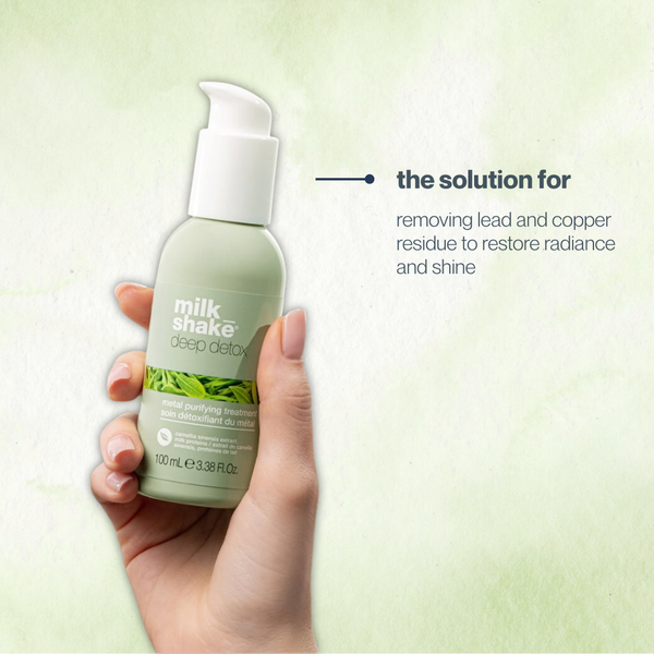Hand holding a bottle of 'milk shake' deep detox product with text on a light green background