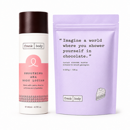 Frank Body Smoothing AHA Body Lotion in a white and pink spray bottle next to a lavender stand-up pouch of Frank Body Cacao Coffee Scrub on a white background.