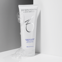 White ZO Skin Health Hydrating Cleanser tube with bubbles