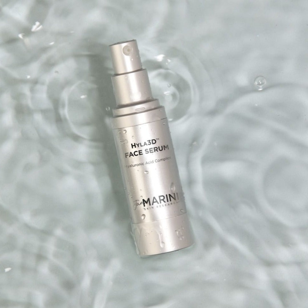 Jan Marini Hyla3D Face Serum in a pool of water