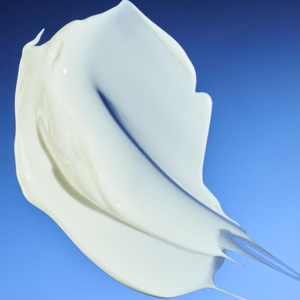 White ceramic sculpture on a blue background