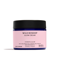 Pink jar of Wild Rosehip Glow Cream with black lid on a white background