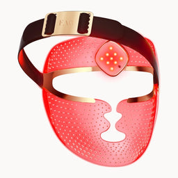 A red light therapy face mask with a black headband and gold metal accents, shown against a plain white background.