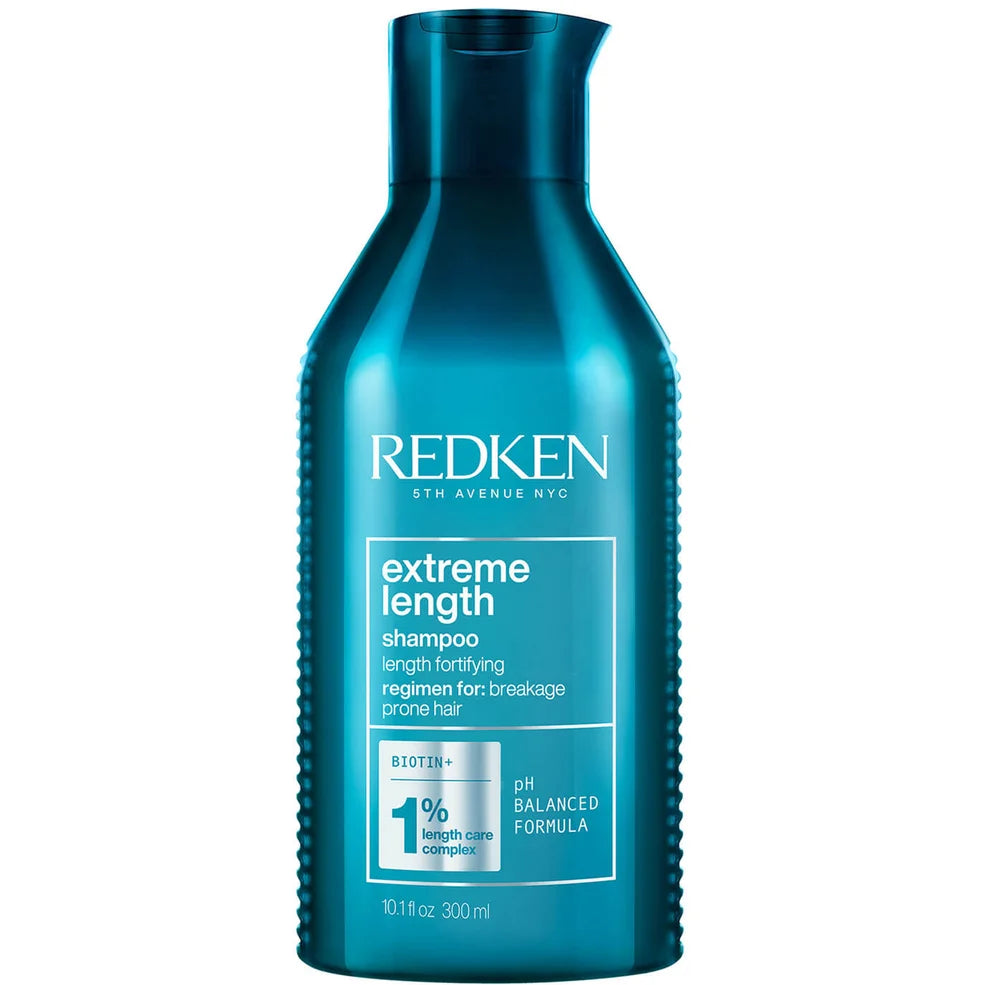 Blue bottle of Redken Extreme Length shampoo on a white background