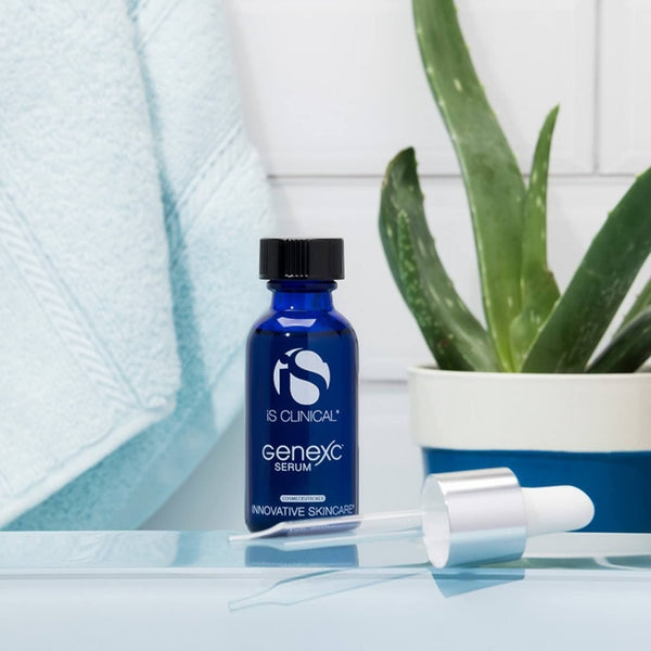 iS Clinical GenexC Serum bottle next to a cactus 
