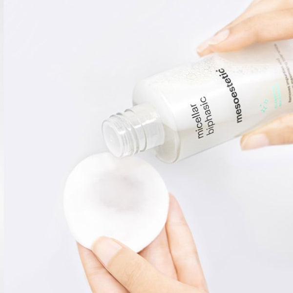 mesoestetic Micellar Biphasic being poured onto a cotton cloth
