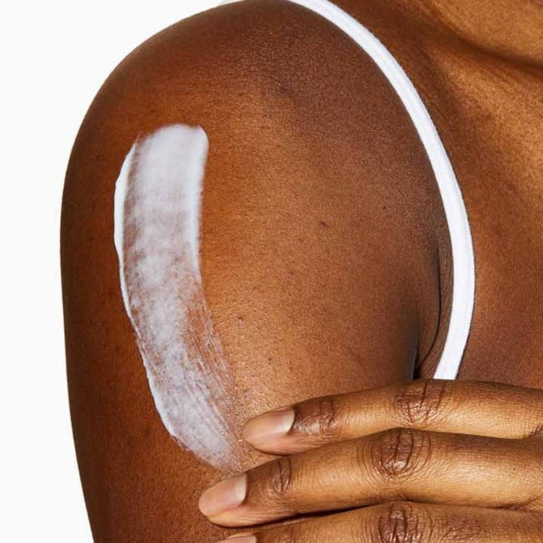 Model using CeraVe Moisturising Cream on their arm