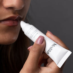 a model applying the lip balm