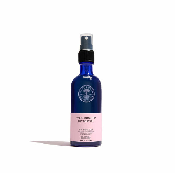 Blue bottle of Wild Rosehip Dry Body Oil on a white background