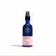 Blue bottle of Wild Rosehip Dry Body Oil on a white background